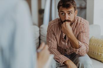 Man Sitting At Therapy
